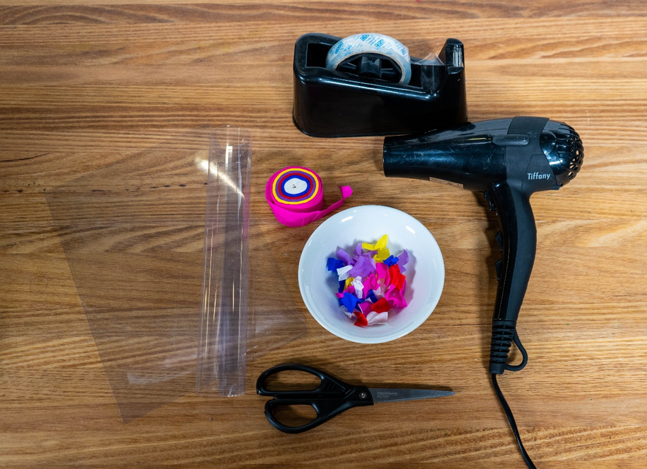 A top down view of a range of objects laid out on a wooden table as listed in the You’ll Need section.