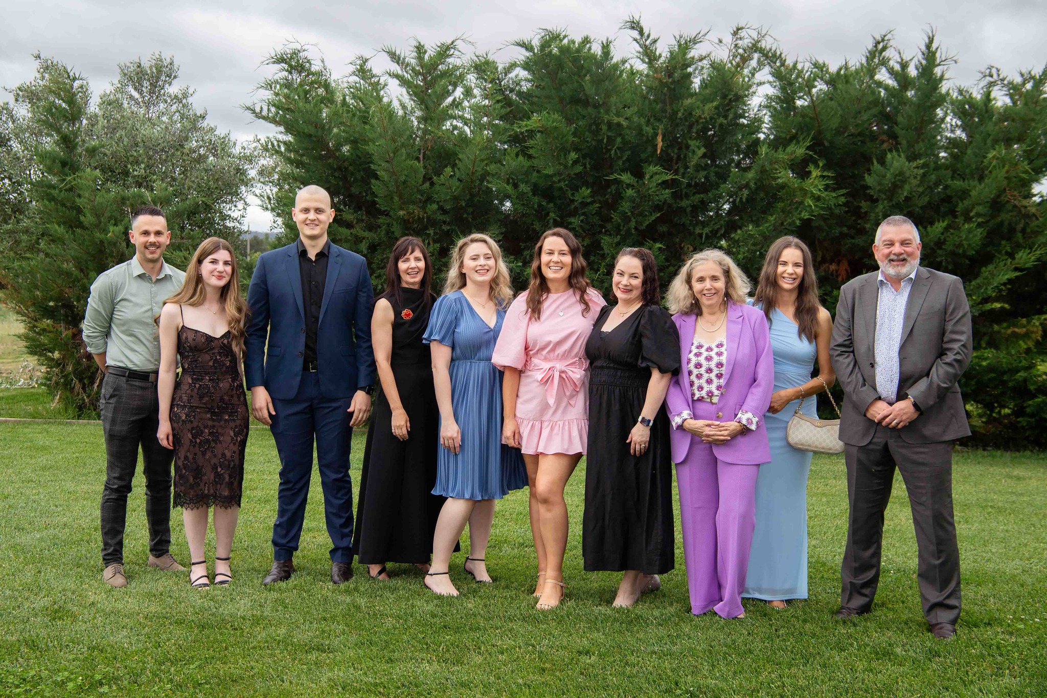 A group photo of Questacon staff at a park