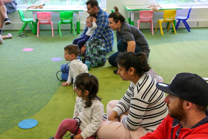 Image of children and carers in science time sitting on the floor