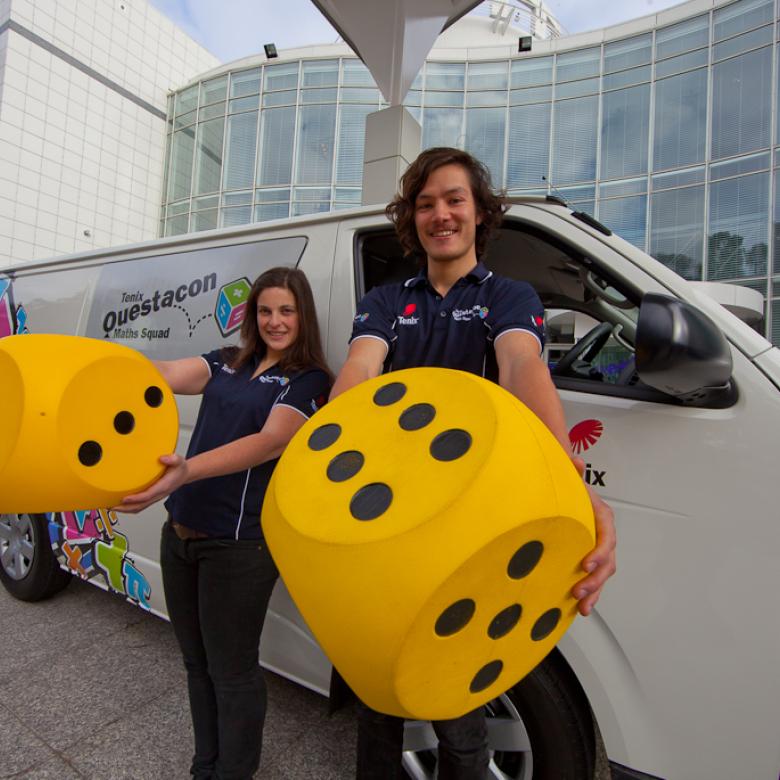 Questacon Maths Squad presenters hold giant dice