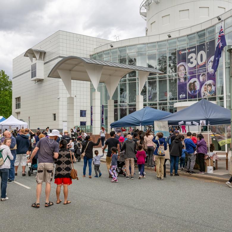 A crowd outside Questacon celebrating its 30th anniversary