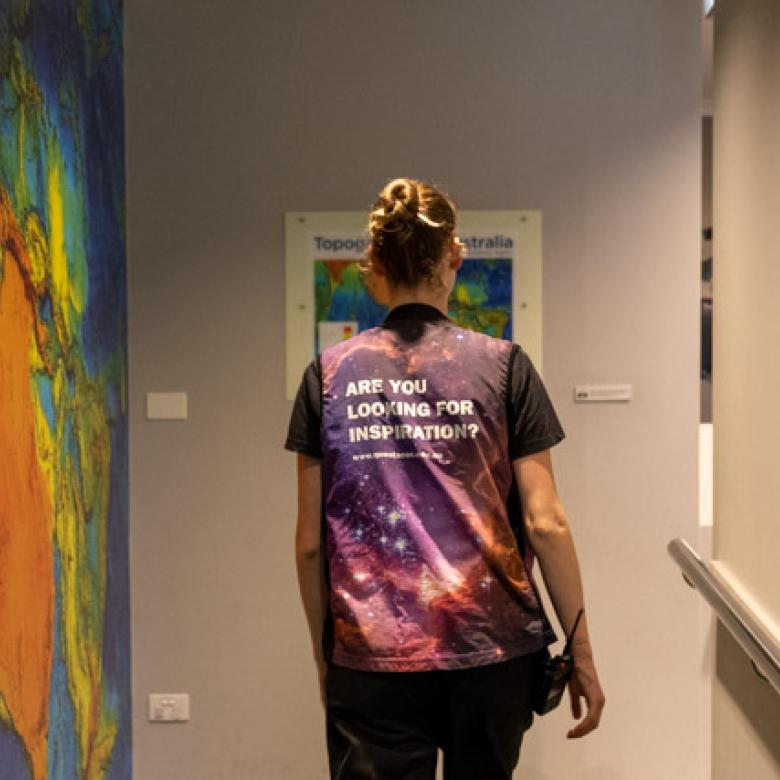 Staff member walking inside the Earthquake Lab 