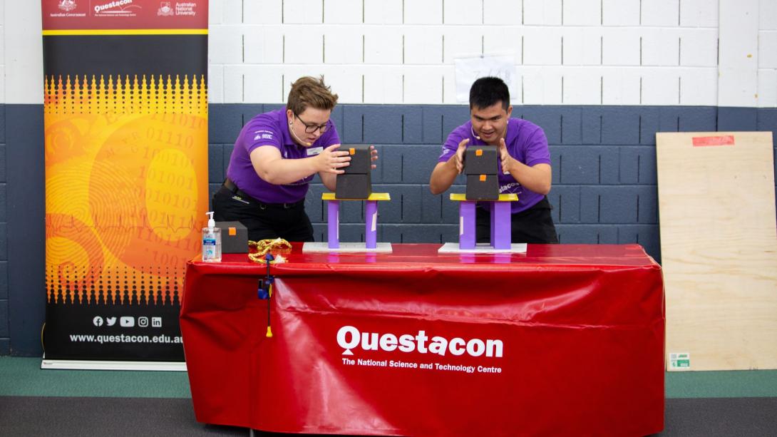 Questacon Presenters are pictured balancing blocks