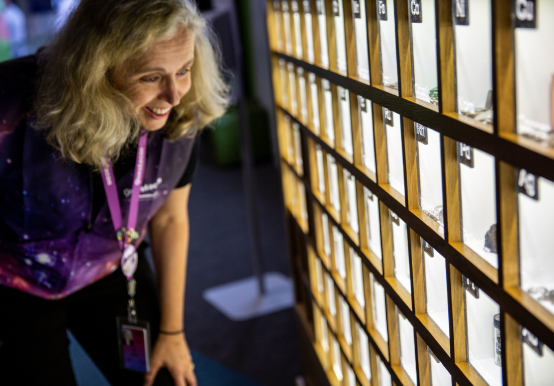 Image of Director JO White looking at the periodic table exhibit